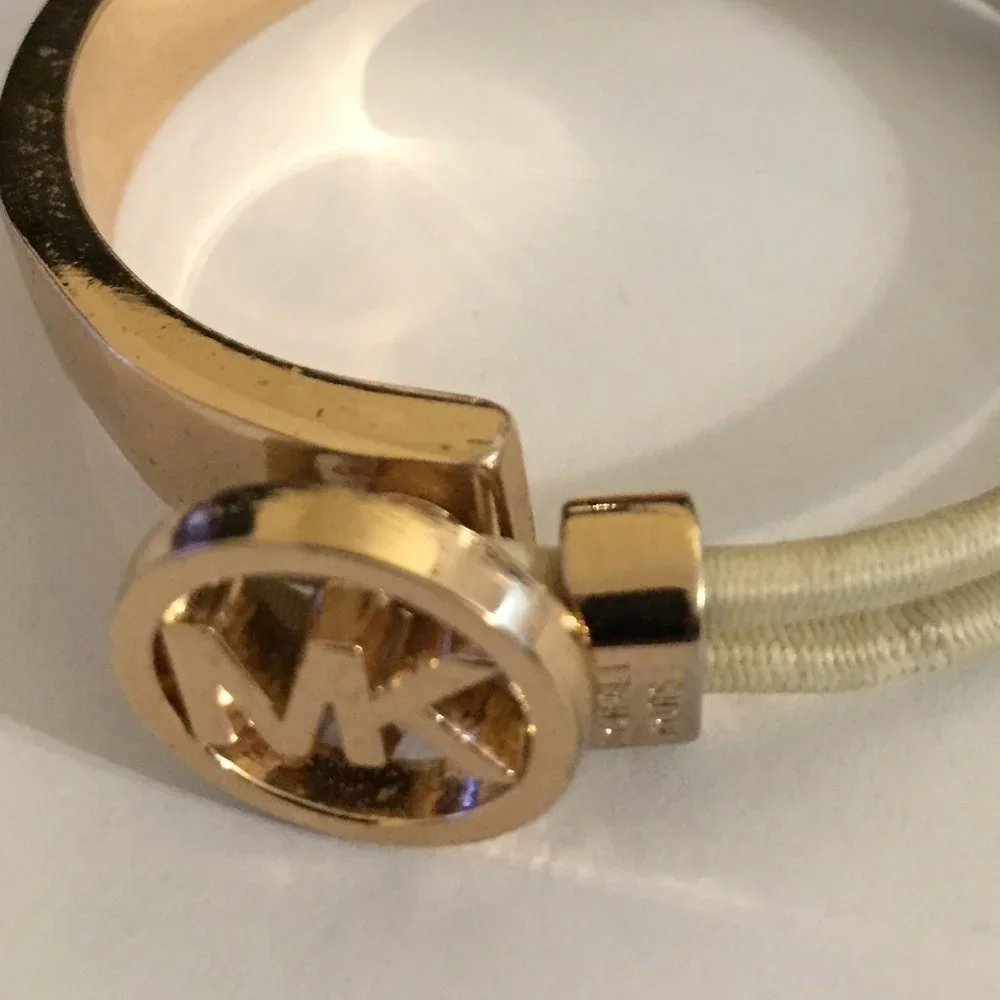 Michael Kors Stretch Bracelet with MK symbol. Gold tone and black cord. No blemi - Picture 2 of 3